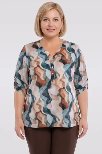 Bēša blūze ar zaļiem rakstiem